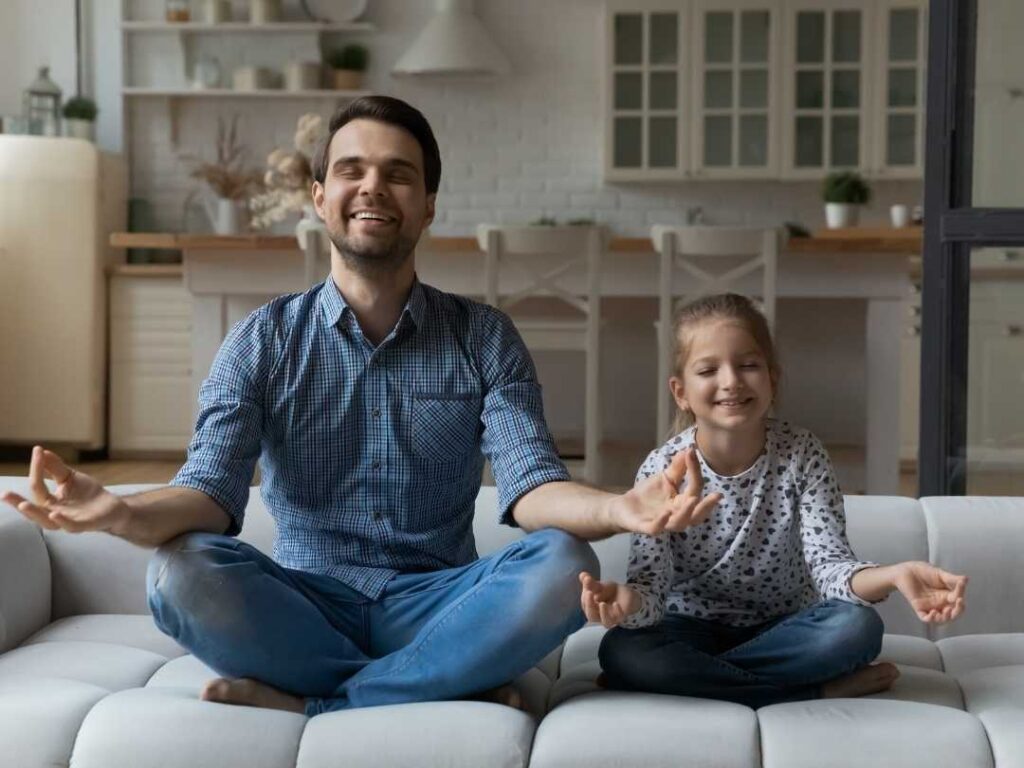 dad enjoying meditation with girl