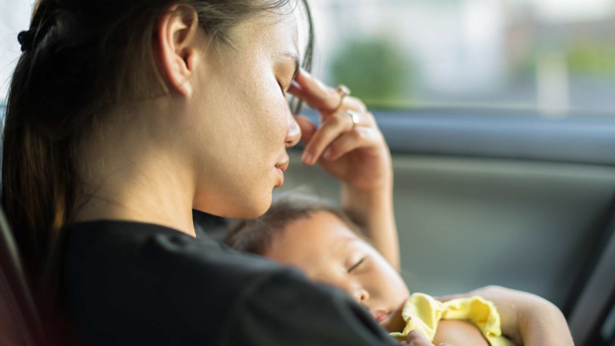 stressed mum holding baby